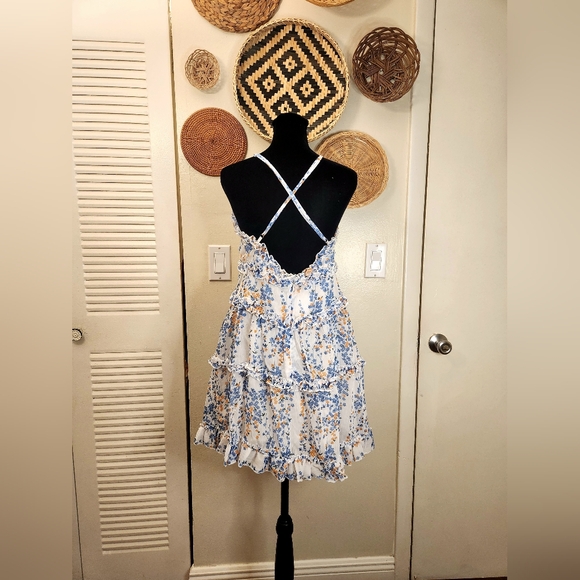 LAST ONE! Blue And White Floral Mini Dress With Ruffles And Criss-Cross Back - Picture 11 of 11